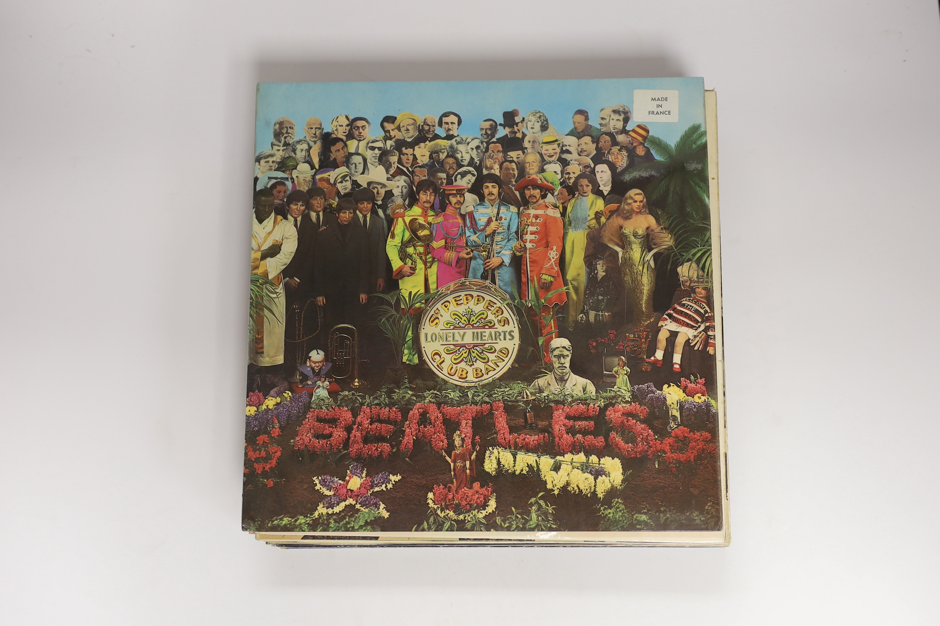 Fourteen The Beatles and related LP record albums including; Sergeant Pepper (with inserts), the White Album, Abbey Road, Magical Mystery Tour, etc.